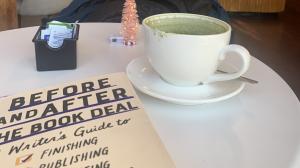 A book and a matcha on a coffee table