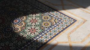 Sunlight falling on colorful mosaic tile floor