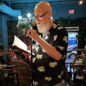 Poet Marc Thomas reading at the Savannah Poetry Co-Op Open Mic at the Water Witch Tiki Bar